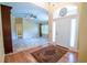 Inviting foyer boasts high ceilings, decorative glasswork, and warm, neutral tones, creating an elegant entry at 1550 Kevin Ln, Deland, FL 32724