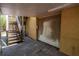 Garage with overhead door and staircase leading to an upper level, providing extra space and accessibility at 1550 Kevin Ln, Deland, FL 32724