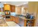 This gourmet kitchen features granite countertops, stainless steel appliances and beautiful cabinets at 1550 Kevin Ln, Deland, FL 32724