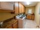 Convenient laundry room with washer, dryer, utility sink, and ample cabinet space at 1550 Kevin Ln, Deland, FL 32724