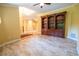 View of living room with bookcase and tile flooring at 1550 Kevin Ln, Deland, FL 32724