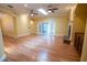 A spacious living room with wood floors, fireplace, multiple windows and an open floor plan at 1550 Kevin Ln, Deland, FL 32724