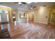 Spacious living room with wood flooring, ceiling fans and lots of natural light at 1550 Kevin Ln, Deland, FL 32724