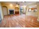 Spacious living room featuring hardwood floors, a fireplace, and an open floor plan at 1550 Kevin Ln, Deland, FL 32724