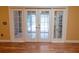 French doors lead from living area to the outdoor patio at 1550 Kevin Ln, Deland, FL 32724