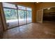 Enclosed patio with tile flooring and view of pool at 1550 Kevin Ln, Deland, FL 32724