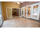 Enclosed patio has tile flooring leading into an entertainment bar area at 1550 Kevin Ln, Deland, FL 32724