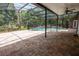 Screened-in pool area with brick patio and view of backyard at 1550 Kevin Ln, Deland, FL 32724