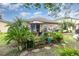Lush backyard featuring a patio, cozy seating, and vibrant plants, creating a peaceful outdoor escape at 15606 Montesino Dr, Orlando, FL 32828