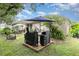 Inviting backyard featuring a grill, outdoor dining, and lush landscaping, perfect for relaxation and outdoor gatherings at 15606 Montesino Dr, Orlando, FL 32828