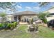 Relaxing backyard with a patio, comfortable seating, and lush greenery, creating a serene outdoor living space at 15606 Montesino Dr, Orlando, FL 32828