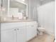 Bright bathroom with double sink vanity, white cabinets, and neutral tile flooring creating a clean and functional space at 15606 Montesino Dr, Orlando, FL 32828
