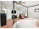 Comfortable bedroom setup showcasing a canopy bed, a work space, and neutral color tones at 15606 Montesino Dr, Orlando, FL 32828