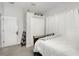 Cozy bedroom featuring a comfortable bed, closet, and decorative shelving, creating a serene and organized space at 15606 Montesino Dr, Orlando, FL 32828
