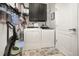Functional laundry room equipped with modern washer, dryer, and storage cabinets for efficient home management at 15606 Montesino Dr, Orlando, FL 32828