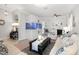 Bright living room with a built-in aquarium, comfortable seating, and stylish decor elements at 15606 Montesino Dr, Orlando, FL 32828