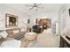 Spacious living room features comfortable seating, neutral tones, and an open layout to the kitchen at 15606 Montesino Dr, Orlando, FL 32828