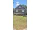 Charming home exterior with fresh landscaping, new siding, and vibrant lawn at 1717 Se 190Th Ave, Silver Springs, FL 34488