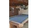 Basement game room boasts a pool table, wall art, and a Bud Light sign at 1717 Se 190Th Ave, Silver Springs, FL 34488