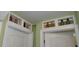 Charming hallway with unique decorative touches above the doorways, adding character to the home at 1717 Se 190Th Ave, Silver Springs, FL 34488