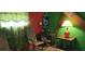 Funky living room featuring chairs, a colorful table lamp, and eye-catching decor at 1717 Se 190Th Ave, Silver Springs, FL 34488