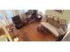 A full shot of the living room that showcases the hardwood flooring and multiple seating options at 1717 Se 190Th Ave, Silver Springs, FL 34488