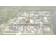 Charming waterfront house aerial view featuring canal access, a boat and mature trees at 1721 Perch Ln, Sanford, FL 32771
