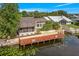 Back exterior featuring a waterfront property and dock at 1721 Perch Ln, Sanford, FL 32771
