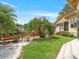 Waterfront backyard with a patio, dock and lush landscaping at 1721 Perch Ln, Sanford, FL 32771