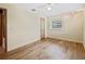 Bedroom with wood floors, ceiling fan, track lighting, and a window for natural light at 1721 Perch Ln, Sanford, FL 32771
