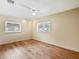 Bedroom featuring wood floors, ceiling fan, track lighting, and a bright window at 1721 Perch Ln, Sanford, FL 32771