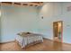 Spacious bedroom with light blue walls and wood floors leading to the en suite bath at 1721 Perch Ln, Sanford, FL 32771