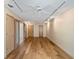Bonus room with wood floors, track lighting, ceiling fan and doors to other areas of the home at 1721 Perch Ln, Sanford, FL 32771