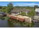 Elegant waterfront home boasting a spacious deck, screened porch, and direct access to the canal at 1721 Perch Ln, Sanford, FL 32771