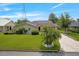 Well-kept home with green lawn, brick-paved driveway, and charming curb appeal at 1721 Perch Ln, Sanford, FL 32771
