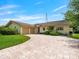 Charming home featuring a tile roof, paved driveway, and well-maintained landscaping at 1721 Perch Ln, Sanford, FL 32771