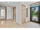 Bright hallway featuring a tiled floor and modern accents at 1721 Perch Ln, Sanford, FL 32771