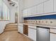 Convenient wet bar area with tile countertops, cabinets, a sink, and a mini-fridge at 1721 Perch Ln, Sanford, FL 32771