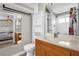 Bright bathroom with modern fixtures, vanity, and shelving providing storage for all your needs at 1784 Fritwell Ct, Ocoee, FL 34761