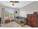 Bedroom featuring a daybed, window, natural light, and ample closet space at 1784 Fritwell Ct, Ocoee, FL 34761