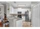 Bright kitchen with white cabinetry, stainless steel appliances, and a breakfast bar with seating at 1784 Fritwell Ct, Ocoee, FL 34761