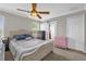 Comfortable bedroom featuring a bed, closet, window, and natural light at 1784 Fritwell Ct, Ocoee, FL 34761