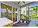 Relax on the covered patio with views of the backyard while using the outdoor kitchen and grill at 1784 Fritwell Ct, Ocoee, FL 34761