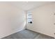 Simple bedroom with carpet, one window, and white walls at 196 Duckweed Ave, Fruitland Park, FL 34731