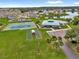 Aerial view showcasing community amenities: pool, tennis court, bocce, and clubhouse at 222 Ellsworth Dr, Kissimmee, FL 34758