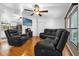 Spacious living room with comfortable seating, hardwood floors, and natural light at 222 Ellsworth Dr, Kissimmee, FL 34758