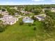 Aerial shot showing a neighborhood with similar single-story homes with green yards at 222 Ellsworth Dr, Kissimmee, FL 34758