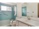 Bathroom featuring walk-in shower, grab bars, updated vanity and mirror at 2290 Carson Ln, Deltona, FL 32738