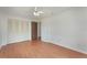 Bedroom showcasing a closet with folding doors and wood-look laminate flooring at 2290 Carson Ln, Deltona, FL 32738
