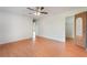 Bedroom with laminate flooring, ceiling fan, and access to a closet at 2290 Carson Ln, Deltona, FL 32738